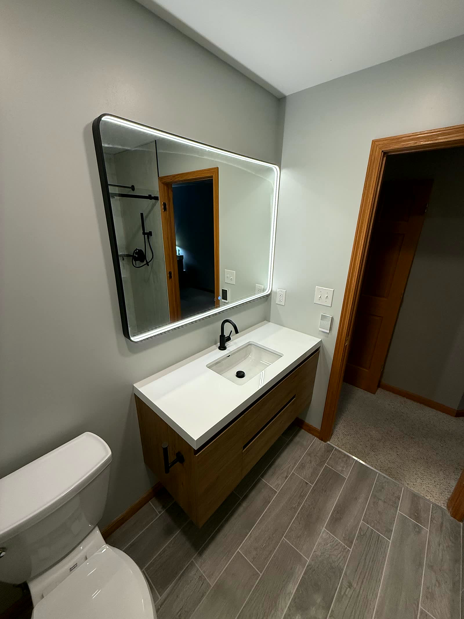 Modern floating vanity with LED mirror