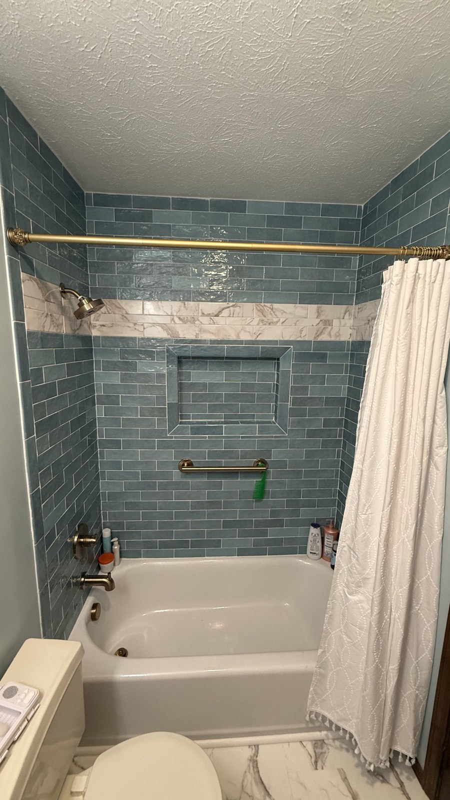 Tiled tub surround with new fixtures