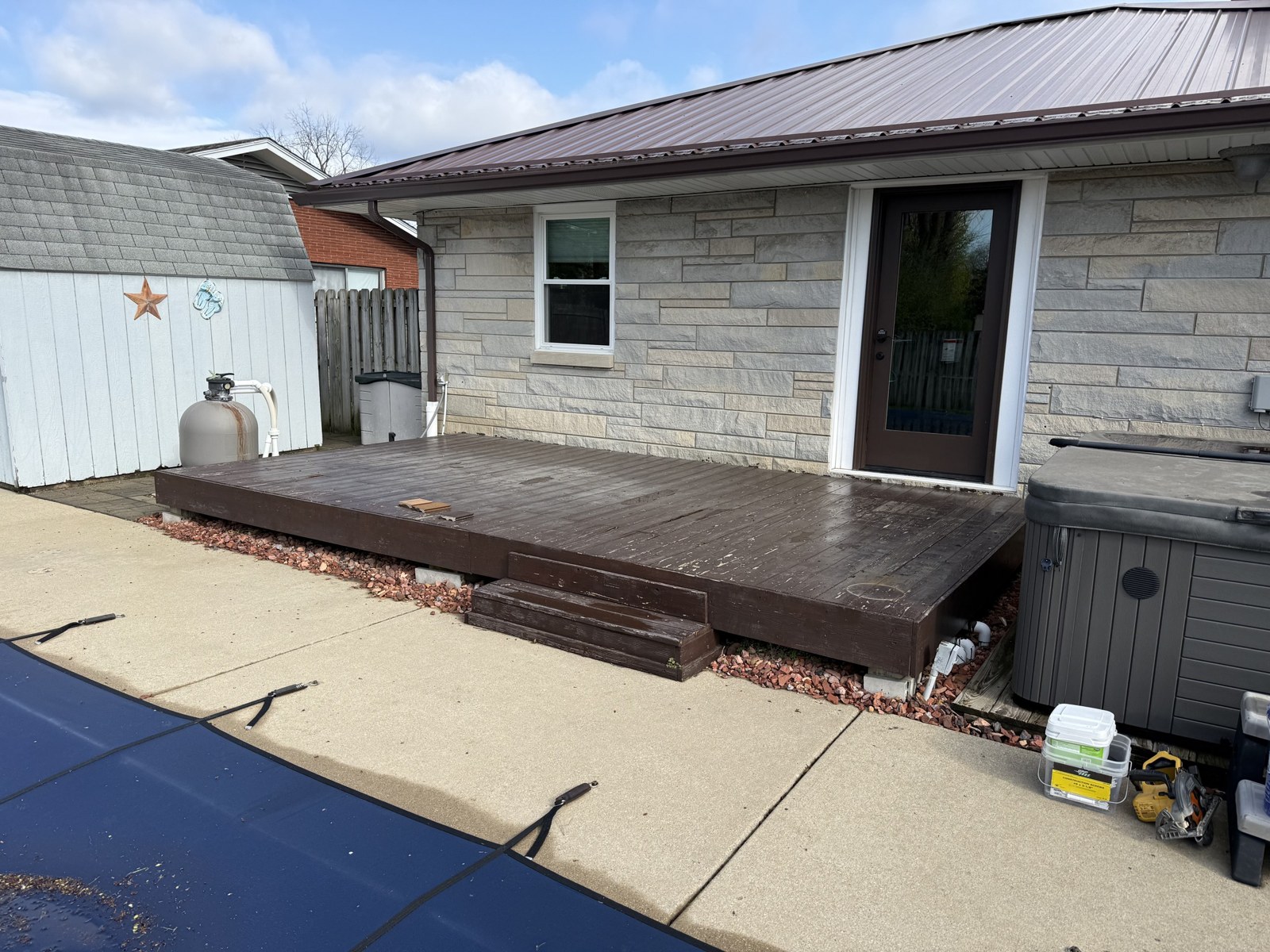 Deck before replacement — worn, aging deck boards