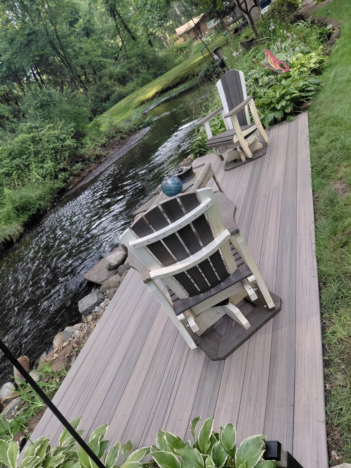 Creekside walkway after — new composite deck and seating area
