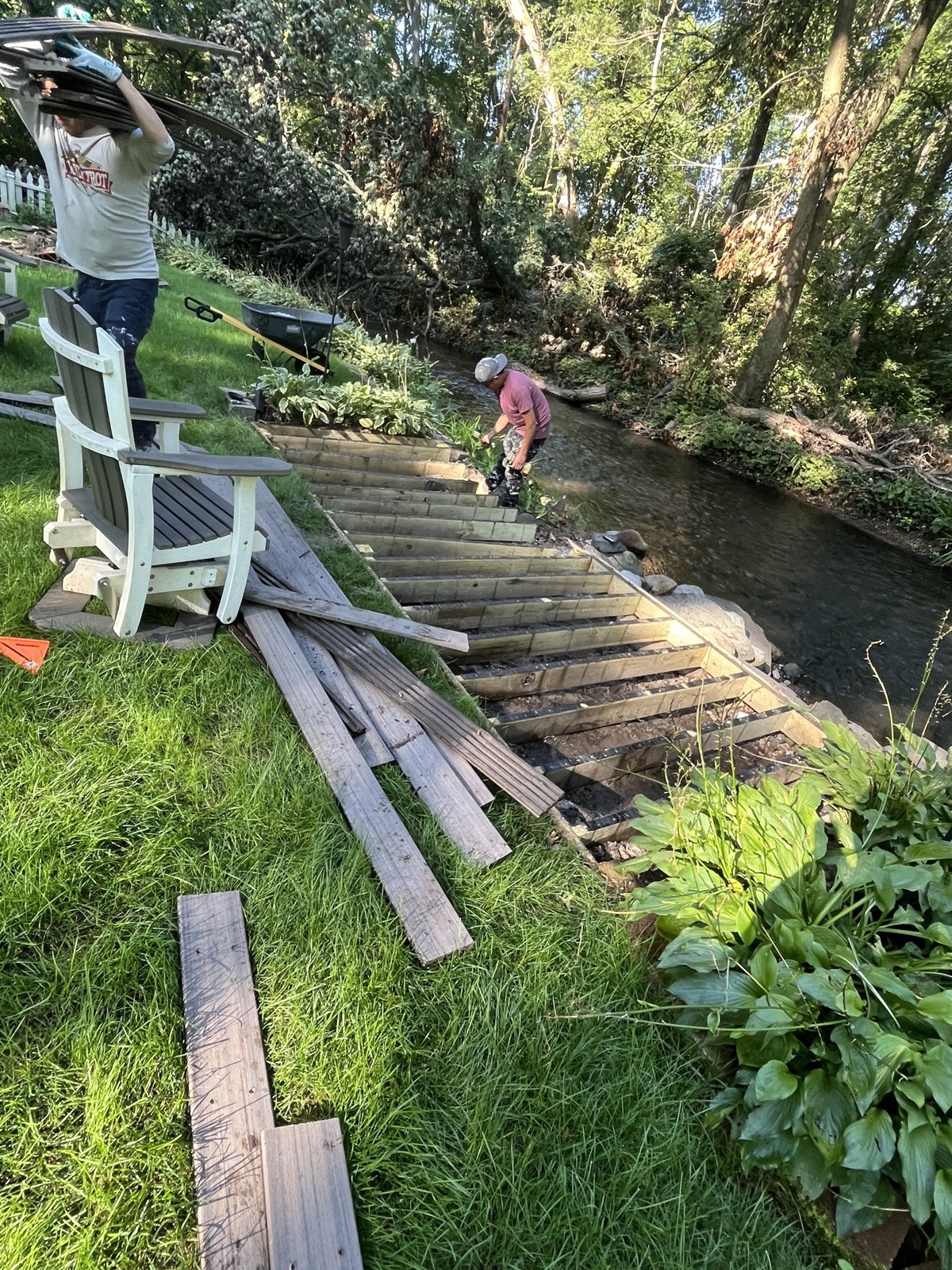 Creekside walkway before — rotted boards and worn steps