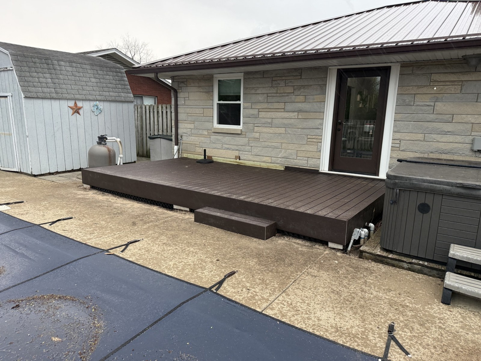 Finished composite deck running along the house