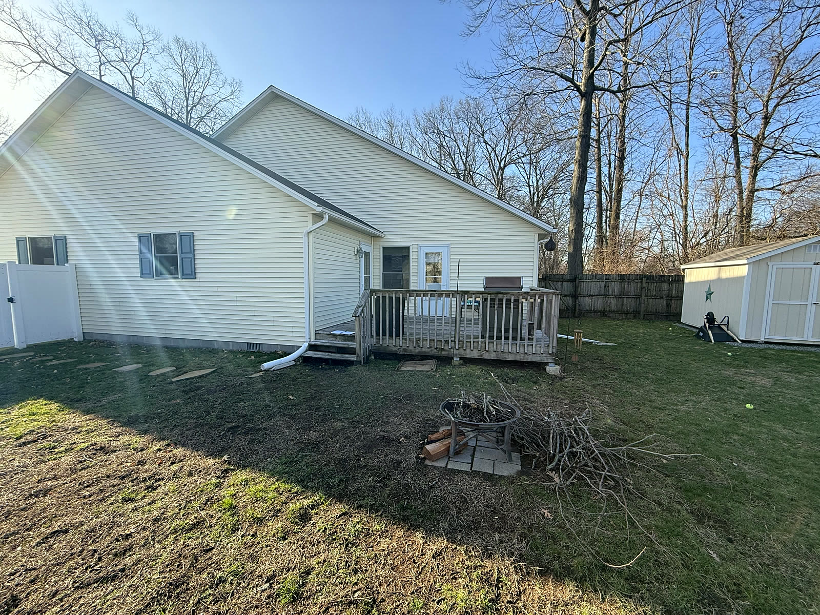 Backyard before — bare dirt and unused space