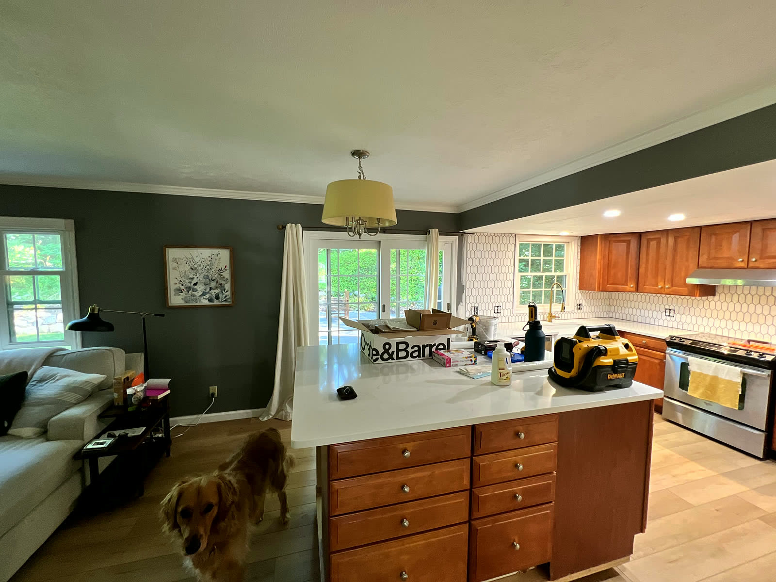 Open-concept kitchen remodel with island and quartz counters