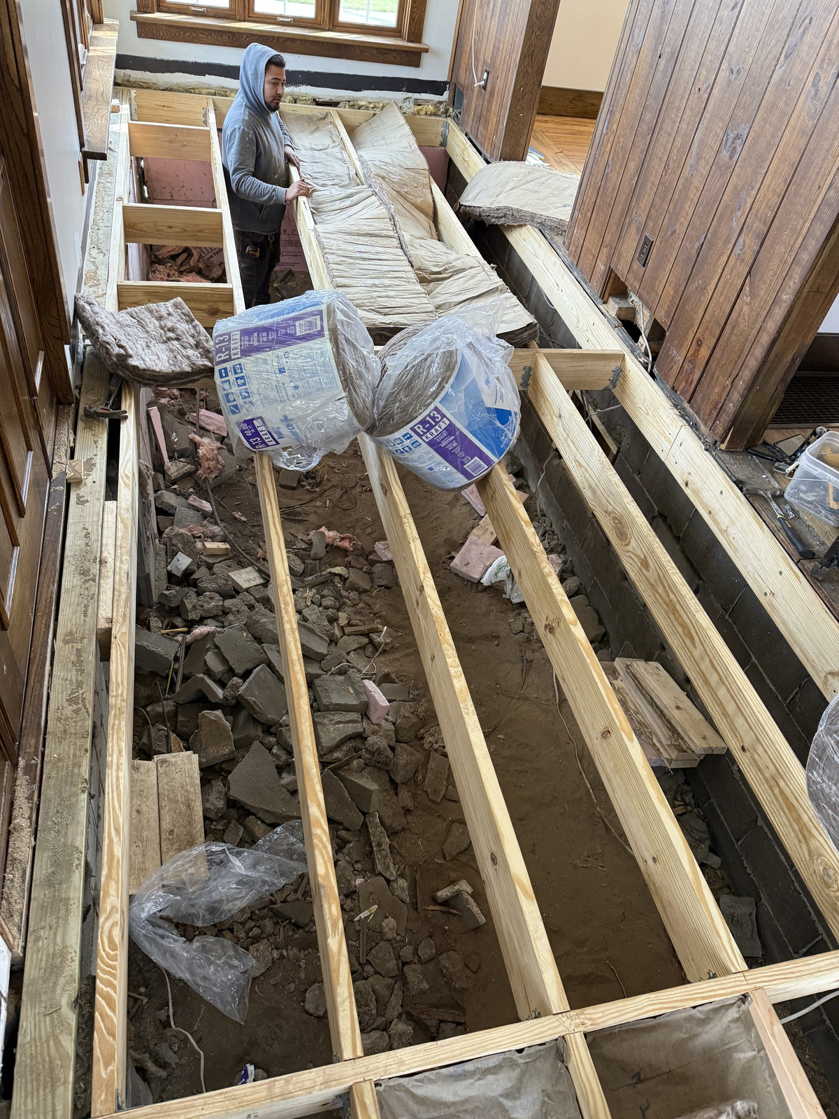 New floor joists sistered in with insulation between them